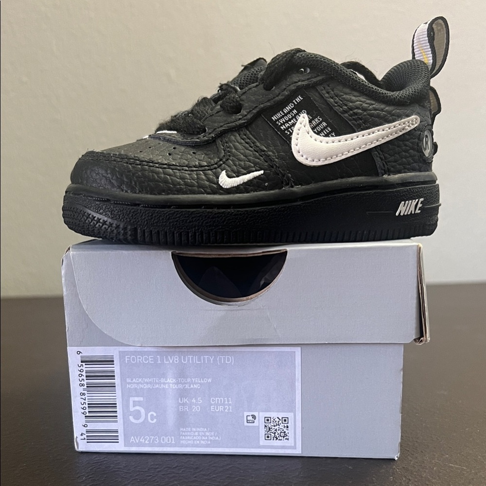 Nike Kids Black and White Low-Top Sneaker with Swoosh
